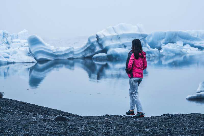 Woman in Jökulsárlón Lagoon Iceland - Iceland Glaciers Tour - 9 Day Iceland Itinerary with Kids