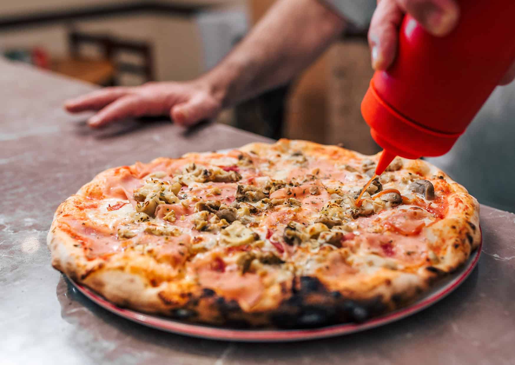 Ketchup on pizza